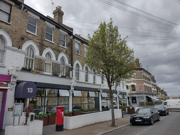 Fig. 86: Commercial use and building scale continues on the west side of Alme Road, terminating at the East Hill Public House