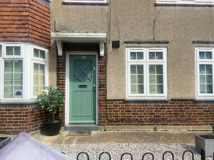 Fig. 57: Original style door under simple masonry porch hood with classical brackets