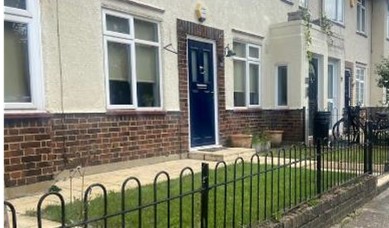 Fig. 66: House type where the front elevation is almost entirely rendered except the brick base which also forms part of the door surround.