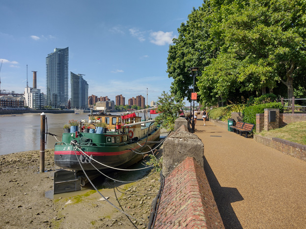 Fig: 69: View of the river frontage with moored barges and Vicarage Gardens