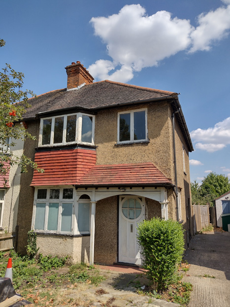 Fig. 13: This house retains many of its original features including the door, porch, and casement windows. The roughcast finish and tiles are also characteristic of the Area, though many others have been painted or rendered.