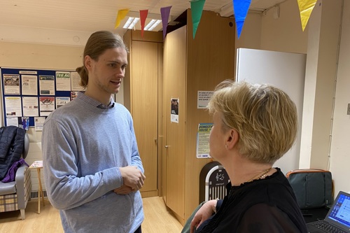 Ukrainian refugee Pavlo speaks to Estate Art's founder Lynne at Manresa Clubroom