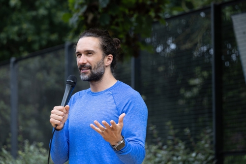 Joe Wicks speaking into a microphone